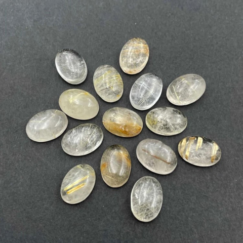 Kwarc z rutylem kaboszon 10x8 mm 1 szt Kwarc z rutylem kaboszon 10x8 mm 1 szt